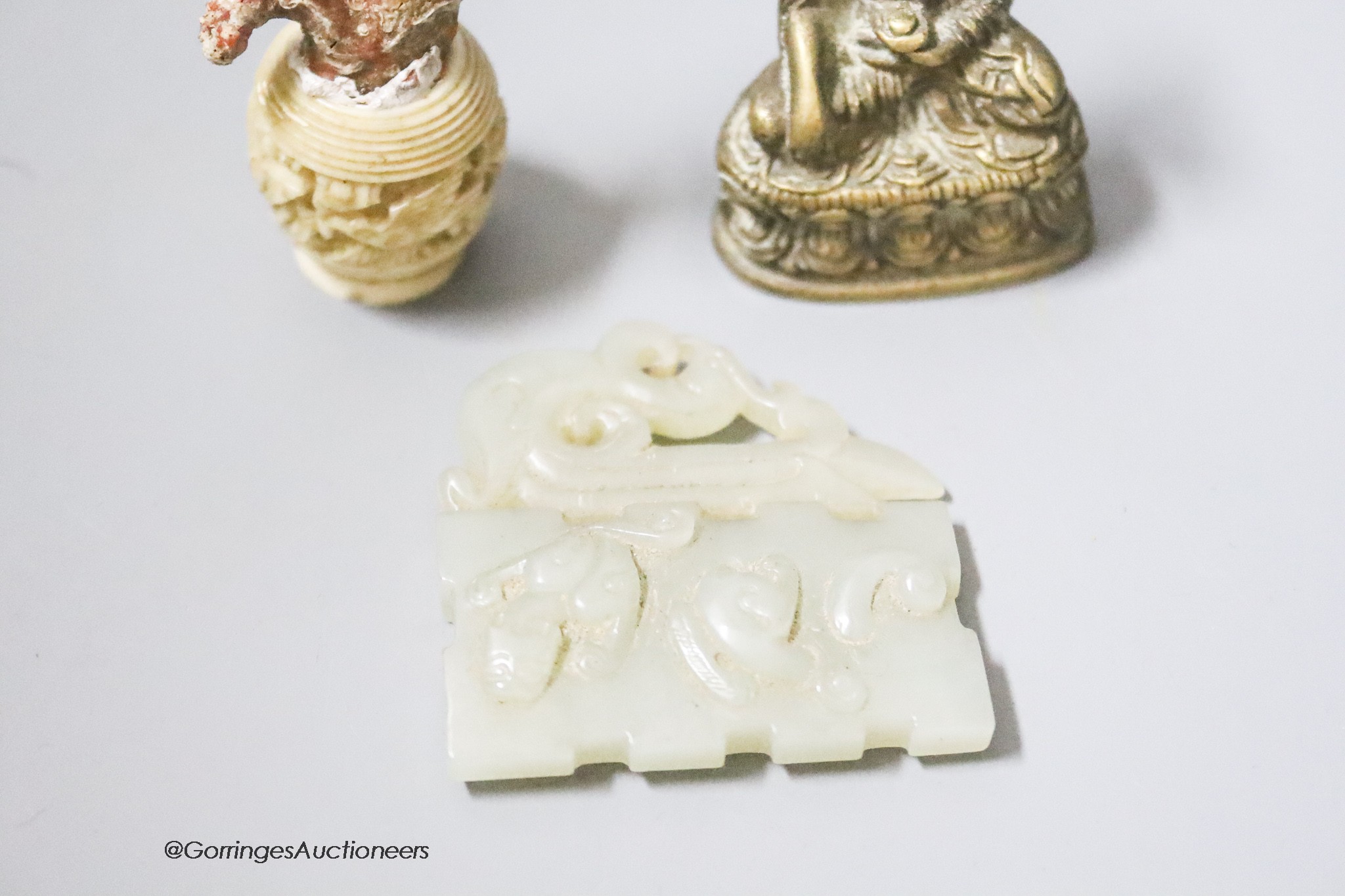 A coral and ivory miniature carving, height 9cm, a Buddha and a carved jade plaque